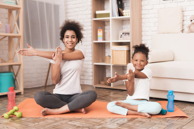 mom-daughter-are-doing-yoga-home_85574-1090.jpg